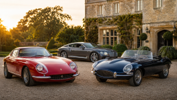 A premium driveway scene with a Ferrari, Jaguar and grand tourer outside a countryside venue